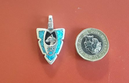 Wolf inset in small arrow pendant