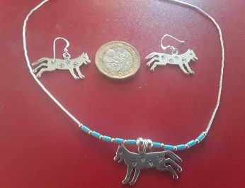 Silver running wolf jewellery with paw prints 2